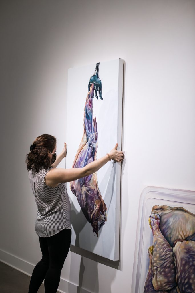 Annette Tojar prepares her art for Paper House