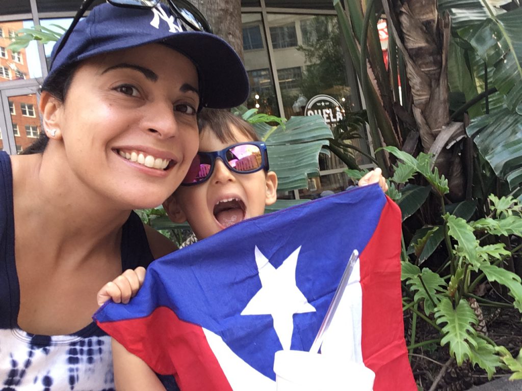 Stacey DiLiberto and her son celebrate at the Orlando Puerto Rican Day Parade