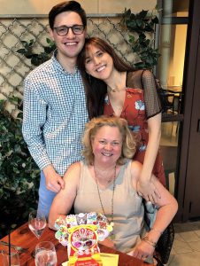 Lynn Hepner poses with her son and daughter