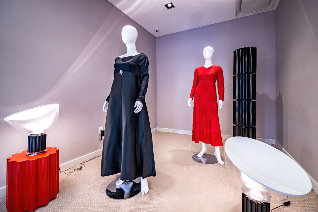 Two gowns on display in the exhibition, “Fashion is Female: Lights on Italian Design as Cultural Legacy,” at the Italian Cultural Institute in Coral Gables.