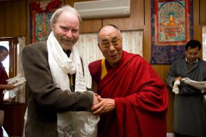 Shaun Gallagher shaking hands with Dalai Lama