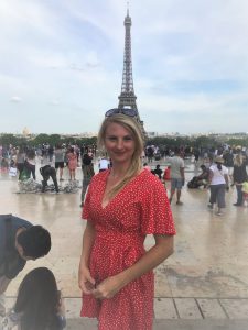 Elizabeth McDonald stands near the Eiffel Tower